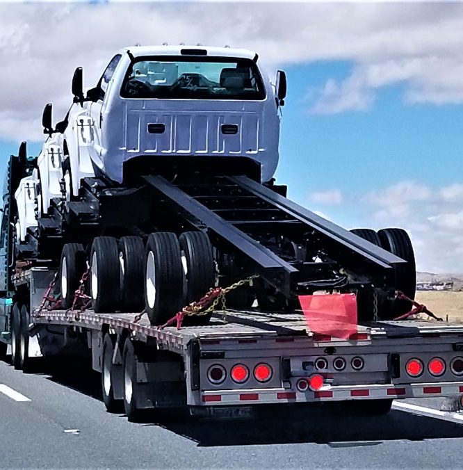 transportation-and-logistics-big-rigs-on-a-flat-b-2026-03-19-05-29-04-utc